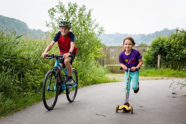 Children cycling and scooting