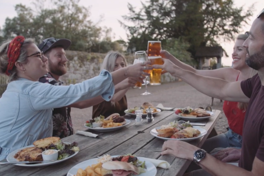 Young people eating and drinking