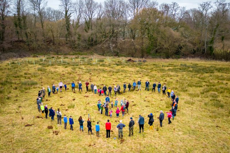 People standing in the shape of a heart